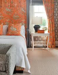 The wall behind this bed. Gray And Orange Bedroom With Toile Curtains Behind Bed Contemporary Bedroom