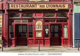 Paris France June 26 2017 View Aux Lyonnais With Original Sign Maison Lyonnaise A Parisian Bistro Dedicated To Cu Paris France Parisian Bistro France