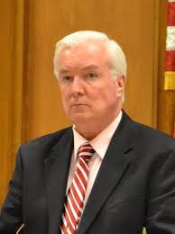 McGlynn Calls for Housing Director's Resignation