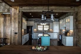 This peninsula matches the hardwood flooring as well as the exposed wooden beams of the ceiling. 5 Log Cabin Kitchen Design Ideas Northern Log