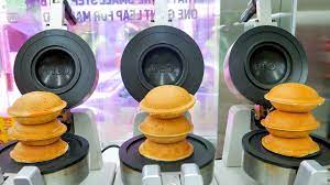 A ball of hamburger with special seasoning, some lettuce, and a secret sauce prepared at chico's pizza parlor, all pressed between bread. People Are Loving South Korea S Ufo Burgers And The Reason Why Is Orgasmic Allkpop