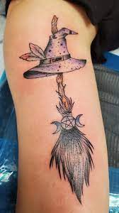 Witch hat and broom tattoo