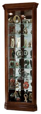 The most common corner curio cabinet material is wood. Howard Miller Cherry Bordeaux Drake Corner Curio Cabinet Traditional China Cabinets And Hutches By Homesquare