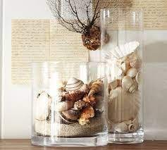 For the lid's knob, use a thin paintbrush to apply glue to a shell and press it onto the lid before letting it dry. Fresh Ideas For Spring Decorating Shell Decor Spring Decor Vases Decor