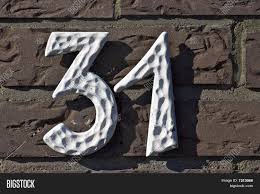 1310 drop front in rusted steel box: House Number 31 Image Photo Free Trial Bigstock