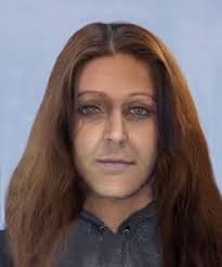 Susan Everett and her children who lived to adulthood. Names listed under  the picture. We think this was when her husband Isham Everett had died and  everyone came home. Tom lived in