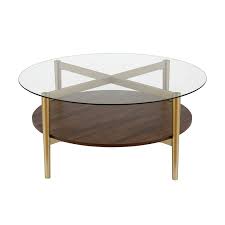 This round coffee table has a walnut tabletop and a black frame. Henn Hart Mid Century Brass Metal Round Coffee Table With Walnut Wood Shelf Ct0140