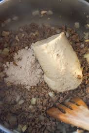 Gravy Mix And Cream Of Mushroom Soup On Top Of Cooked Ground Beef In A Pot Recipe With Cream Of Mushroom Soup Potatoe Casserole Recipes Ground Beef Recipes