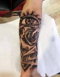Combined with the rose this tattoo is a representation of life after deathconquering an enemy and starting a new life. Rose Eye And Money By Carlos Tattoos