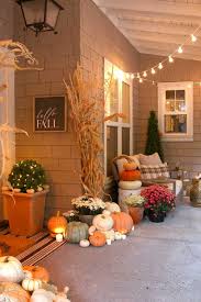 Pumpkins and autumn decorations on the wooden terrace. Neutral Fall Porch Decor With Pumpkins And Cornstalks Fall Decorations Porch Fall Halloween Decor Porch Decorating