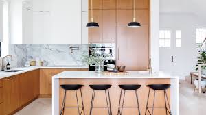 The warm tones and rich textures will provide your kitchen with a friendly and inviting ambiance. See How Wood Cabinets Wow In These 75 Kitchens Bathrooms House Home