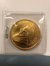 What is the difference between a round and a coin? Gold Coin Anonymously Donated At Salvation Army Red Kettle In Rockford