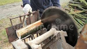 Employ that extra room with this neat design to store your winter firewood. Man In Safety Gloves Put Wood Log Onto Sawmill Seesaw Holder And Cut It Man Cut Firewood By Old Fashion Circular Saw Stock Video Video Of Holder Carpentry 175116103