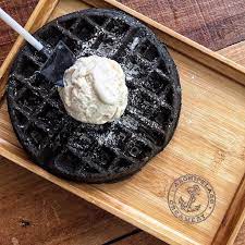 black charcoal waffle with premiere earl grey ice cream food charcoal ice cream earl grey ice cream
