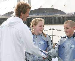 David beckham puts an arm around kate goodwin and harry kane at the launch of his academy in 2005credit: Pin On England World Cup