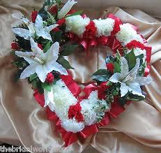 At a funeral, the classic deep red rose evokes love and grief. Wedding Flowers Petals Garlands Name Card All Colours Funeral Flowers Grave Tribute Floral Based Cushion Home Garden