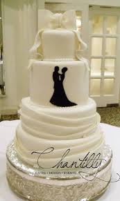 Chantilly El Paso Area Cakes Four Tier Wedding Cake With Fondant Bow Topper Wedding Cakes Wedding Cake Bakers Wedding Bakery