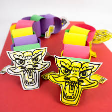 Use the stick to manoeuvre the dragon puppet. Chinese New Year Paper Chain Dragons Printable Included Pink Stripey Socks