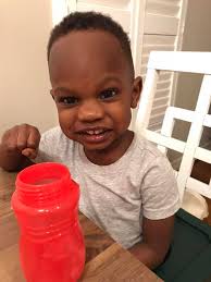 This is the face of the little boy that just called his dad “coo-coo”. He  said “Yes Sir coo -coo.” We told him that's a 'No No' but our faces were  trying