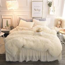 Small bedroom decorating ideas with faux fur, pillows, tapestries. Expensive Looking Pieces Of Affordable Bedroom Decor