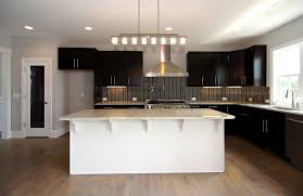 White Island With Seating Espresso Cabinets Stainless Steel Range Hood Glass Tile Back Spl Kitchen Color Trends Kitchen Cabinet Dimensions Espresso Cabinets