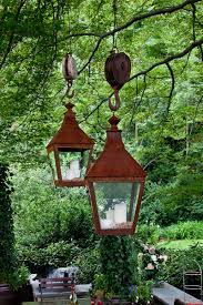 Bird Feeder Pulley System Love The Lanterns Rustic Look But The Pullies Its Attached To Are A Little Overkill Lol But Very Interesting Primitive Decorating Diy Plants Decor