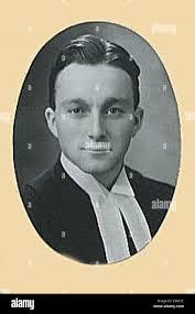 A portrait of John Malcolm Robb, a notable individual born in 1917 and  active in his respective field, possibly during the mid-20th century. The  image provides a visual record of his appearance