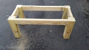 The top should overhang the frame by 1 3/8 inches on the front and back trims and two inches over the end trims. Rustic Coffee Table My Repurposed Life Rescue Re Imagine Repeat