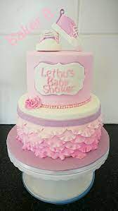 Pink And Purple 2 Tier Baby Shower Cake With Ruffels Plaque And Baby Shoes Baby Shower Cakes Shower Cakes Cake