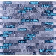 It is interlocking design with blue crystal glass and grey marble stone. Blue Glass Mosaic Clear Crystal Gray Marble Backsplash Random Wave Patter Glass Tile Backsplash Kitchen Marble Tile Backsplash Kitchen Kitchen Tiles Backsplash