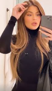 Honey blonde highlights throughout dark hair make for an fun, contrasted look that's especially noticeable in this braided style. Kylie Jenner Ditches Signature Hair For Stunning Lighter Colour In Sleek Makeover Mirror Online