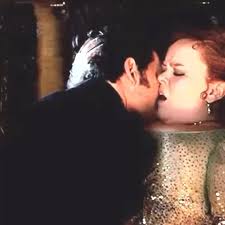 Penelope touching Colin’s hair