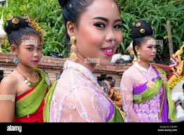 Asia. Thailand, Chiang Mai. Wat Doi Suthep. Young Thai girls wearing  traditional costume Stock Photo