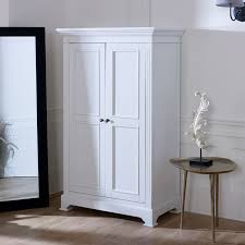 A bedroom armoire or mirrored armoire is a must in the master bedroom. White Linen Closet Low Wardrobe Daventry White Range