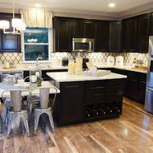 Plastic isn't porous like wood is, so stains aren't going to sink into the surface. Kitchen With Built In Dining Wine Rack Geometric Wallpaper And Industrial Galvanized Chairs M I Homes Of Columbus Cedar Run Wood Laminate Kitchen Cleaning Laminate Wood Floors Mannington Laminate Flooring