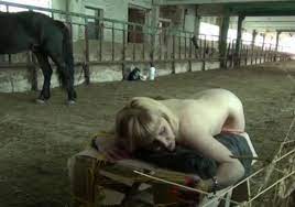 Blonde gets fucked by horse in zoo porn