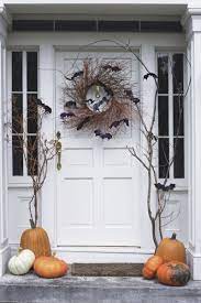 19 Spooky Halloween Decoration Ideas That Are So Chic It S Scary Halloween Outdoor Decorations Diy Halloween Wreath Halloween Door Decorations