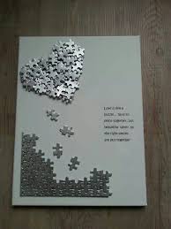 Make a picture frame — hot glue popsicle sticks together into the shape of a frame and cover it in puzzle pieces. Pin By Holly Beinhart On Gift Ideas Puzzle Crafts Puzzle Piece Crafts Valentines Day Cards Handmade