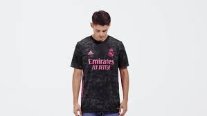 Represent the team in this juniors' adidas football jersey. Adidas Real Madrid 20 21 Third Jersey Black Adidas Australia