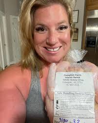 Aleah Walker showing off her Bee keeping skills at the NEOKC Farmers Market  farm in Spencer.