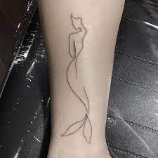 Mermaid tattoos are rather popular in 2019. Here Are 35 Beautiful Single Line Tattoos Blurmark Line Tattoos Leg Tattoos Geometric Tattoo
