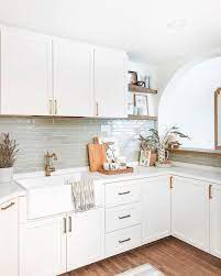 Modern gray white kitchen with gray shelves and white cabinets. 16 Backsplash Ideas Perfect For White Kitchens