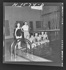 Four-H (4-H) Club Week: Swimming party for youngsters takes place at  Memorial Coliseum pool. Pictured left to right are Ronald Wagoner, Patty  Sims, Jimmy Botkin, Mary Midden, Gene Cobb, Agnes Robinson, and