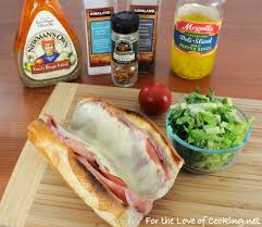 A submarine sandwich, also known as a sub, hoagie, hero, or grinder, is a type of sandwich consisting of a length of bread or roll split lengthwise and filled with a variety of meats, cheeses, vegetables, and condiments. Italian Grinder For The Love Of Cooking
