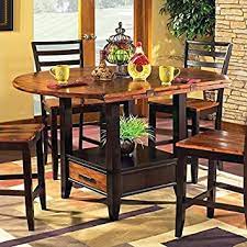 A counter height dining table is ideal for a number of spaces. Amazon Com Steve Silver Abaco Drop Leaf Counter Height Dining Table In Acacia Tables