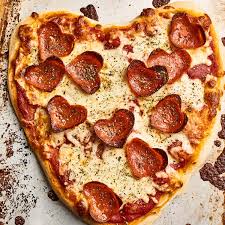 Heart shaped pizza margherita love concept for valentines day with mozzarella, tomatoes, parsley and garlic on vintage wooden table background. Here S How To Make Easy Heart Shaped Pizza At Home Kitchn