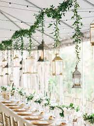 Easy Decor Idea Opting For Small Centerpieces And Supplimenting With Hanging Garland Outdoor Wedding Decorations Lantern Decor Wedding Outdoor Wedding