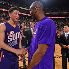 He has black hair and black eyes. Comparing Devin Booker And Kobe Bryant Through First 6 Years Of Careers A Sea Of Blue