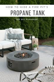 How To Hide A Propane Tank From Your Patio S Fire Pit The Diy Playbook Backyard Fire Fire Pit Backyard Backyard