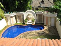Roman Inspired White Plaster Fountain Inbuilt In A Wall With Columns And Ceramic Tiles Near A Blue Pool In 2020 Small Backyard Pools Backyard Pool Small Swimming Pools